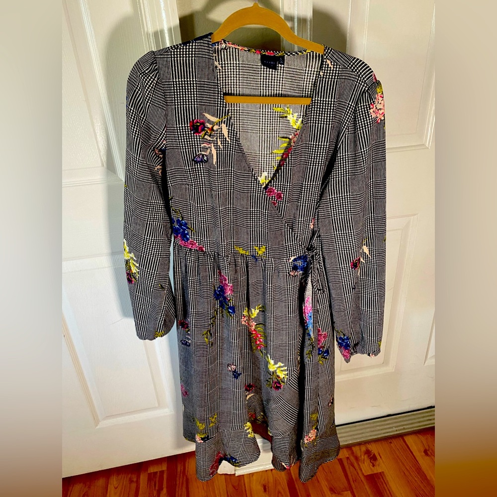 Kaari Blue Spring patterned dress with tasteful floral touches. V-neck,wrap.